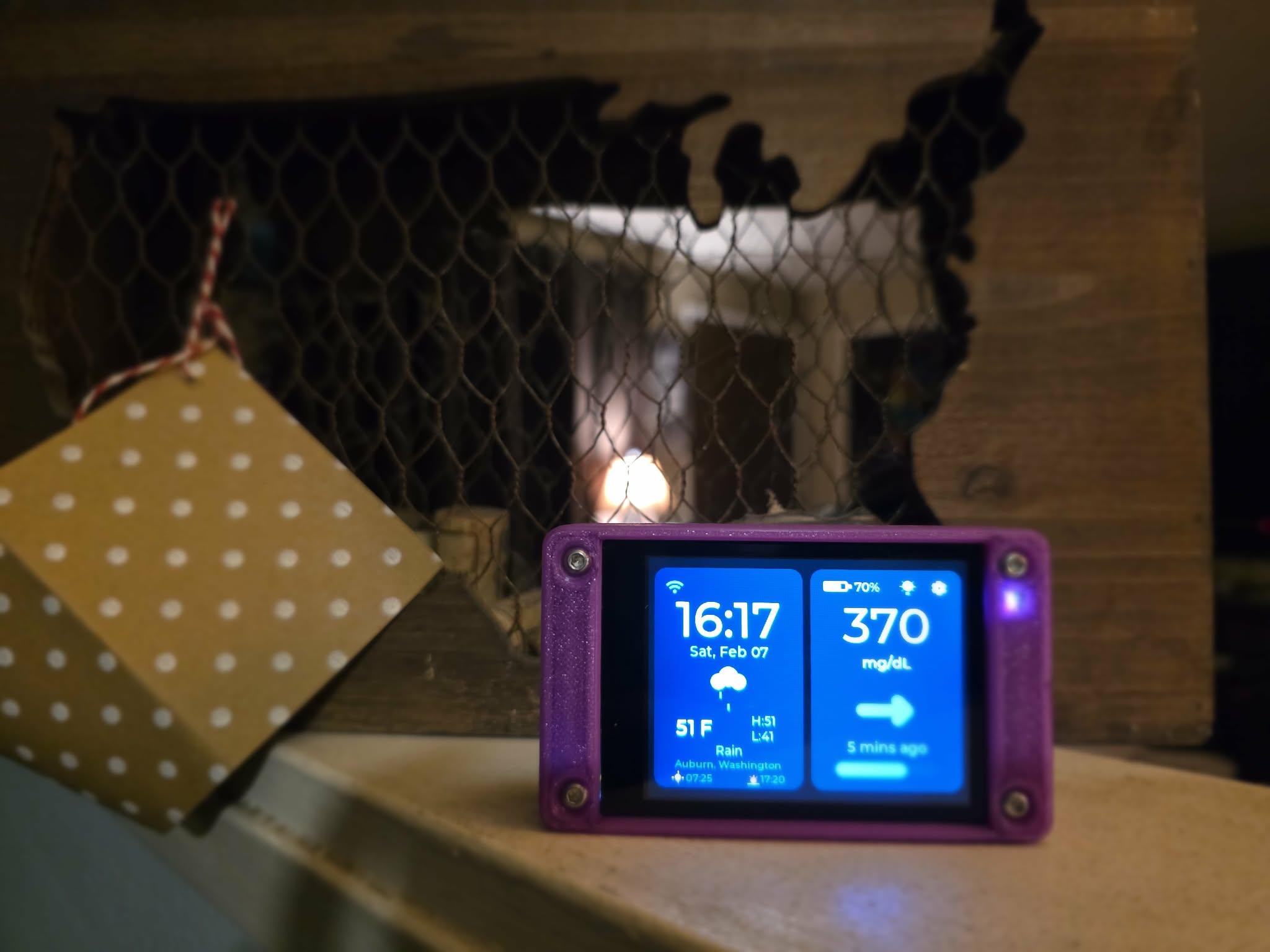 CYGM device on a fireplace mantle